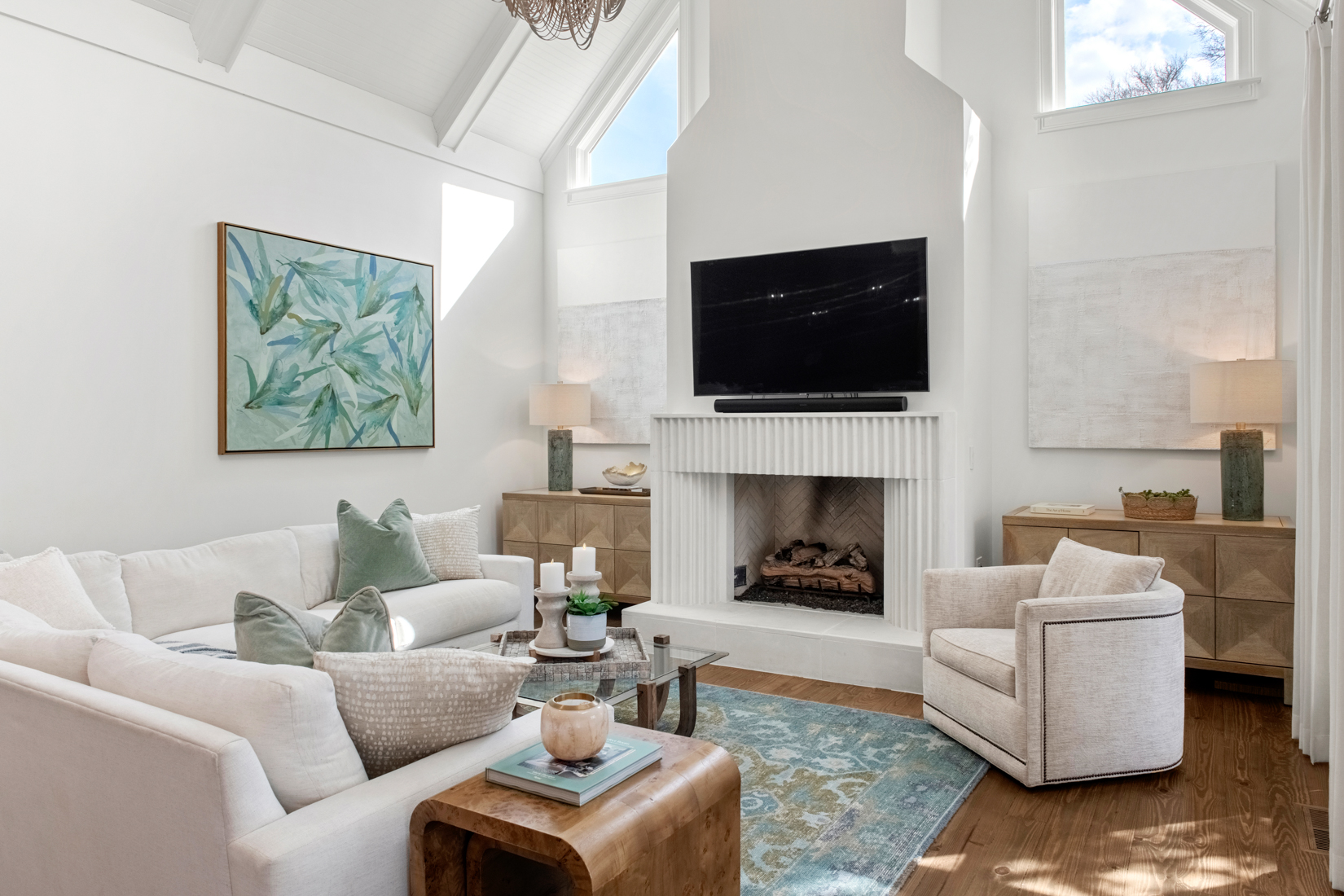 A bright, airy living room with fireplace and carefully curated furnishings